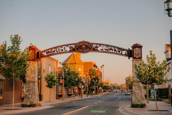 Metal arch over Old Town Temecula at sunset.