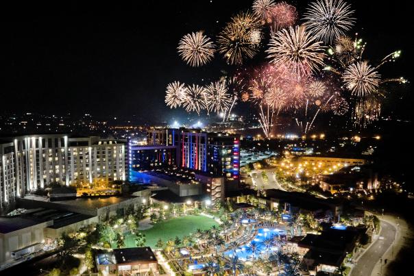 Birds eye view of Pechanga Resort at night as fireworks explode in the sky