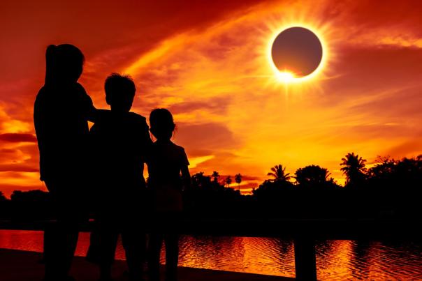 Family viewing solar eclipse