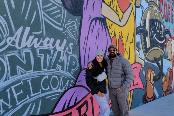 Couple in front of Mural
