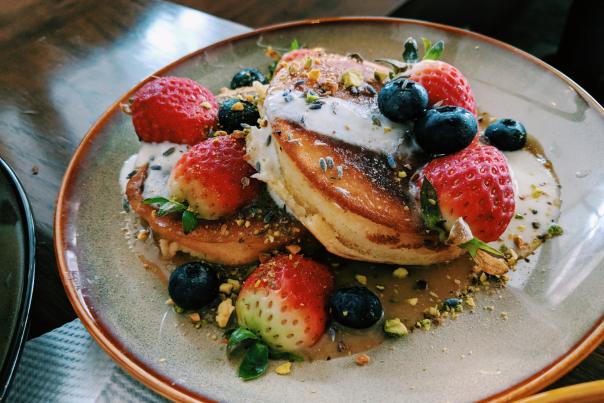 Pancakes with berries and maple syrup