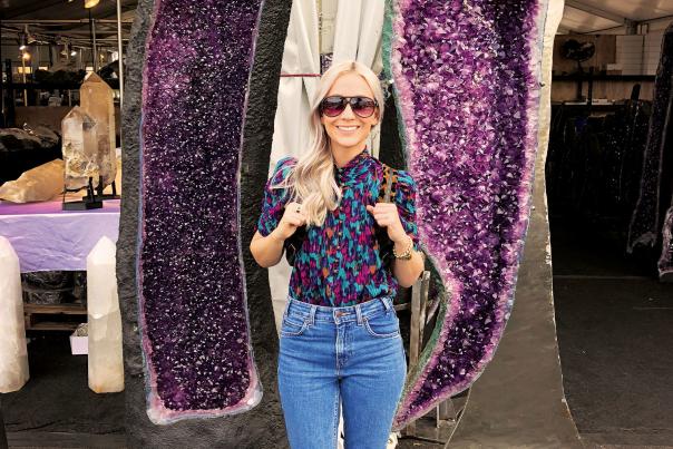 Woman Posing in Front of Large Geode