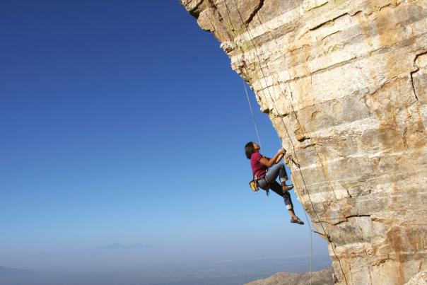 mountain climber cliff rock
