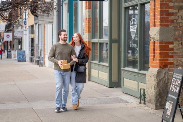 Couple walking down provo center street