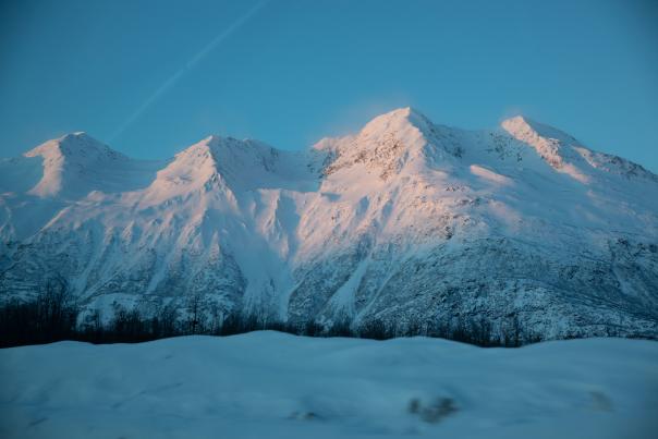 a snowy mountain range and clear sky