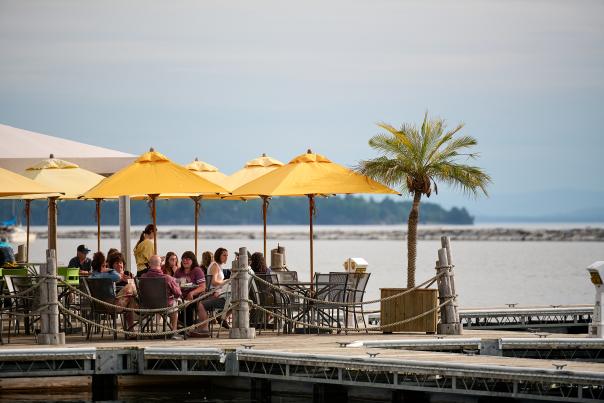 yellow umbrellas and outdoor dining on the edge of Lake Champlain