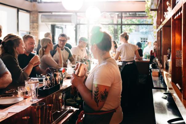 bar tender serving drinks and winter dining in Burlington Vermont
