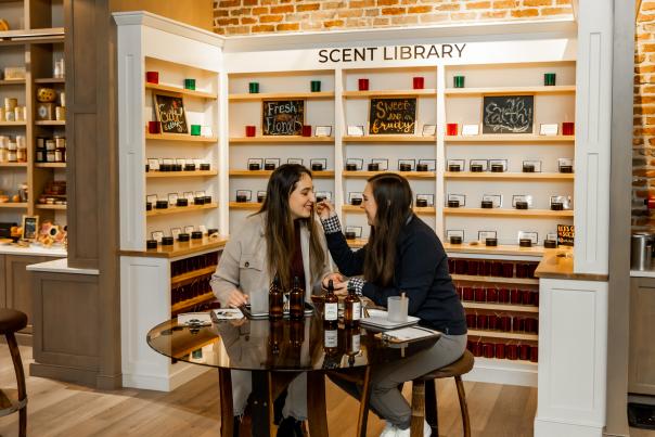 Two women create candles at Cork and Candle in King of Prussia