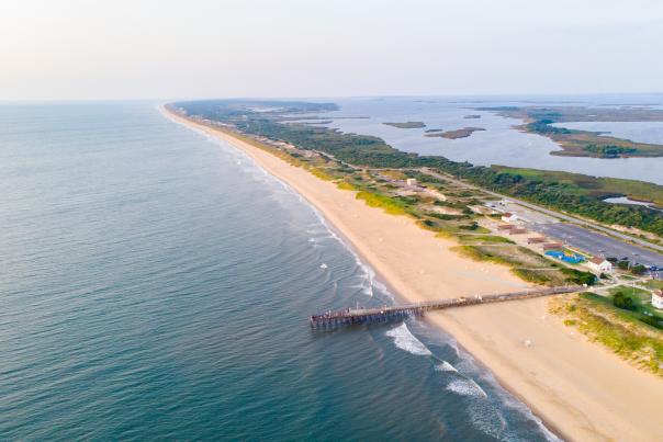 aerial of beach with jetty