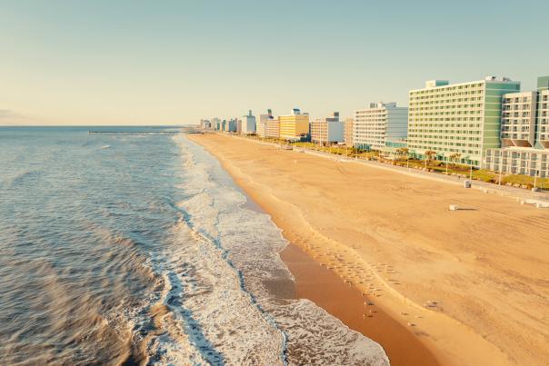 Aerial image of beach with hotels and boardwalk in the distance