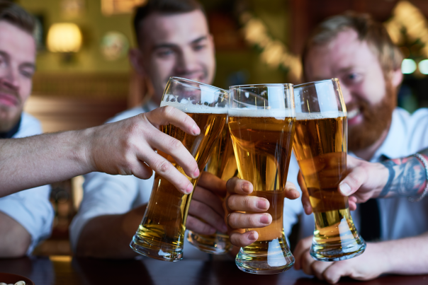 Guys Cheersing with Beer