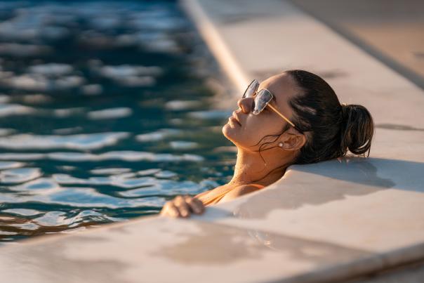 Woman relaxing in San Diego pool