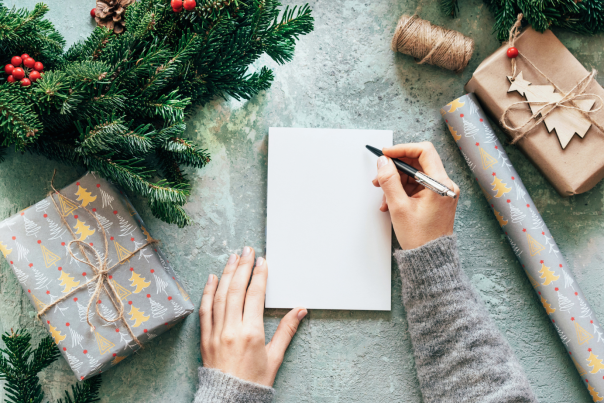 Festive Table with Woman Writing a Note