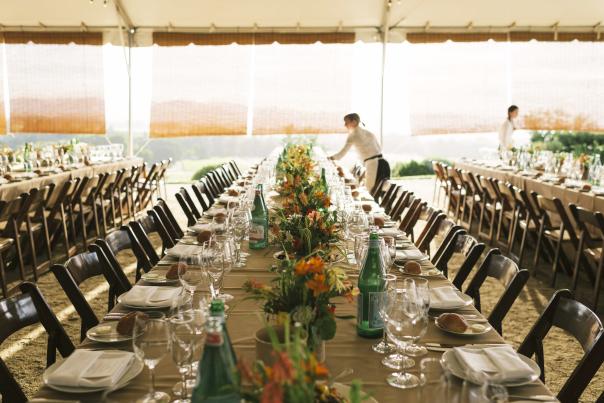 Setting the table at a wine country event.