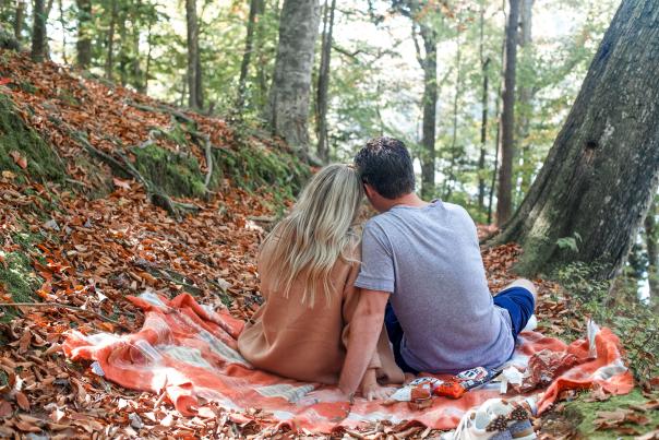 Couple on a picnic in nature during fall