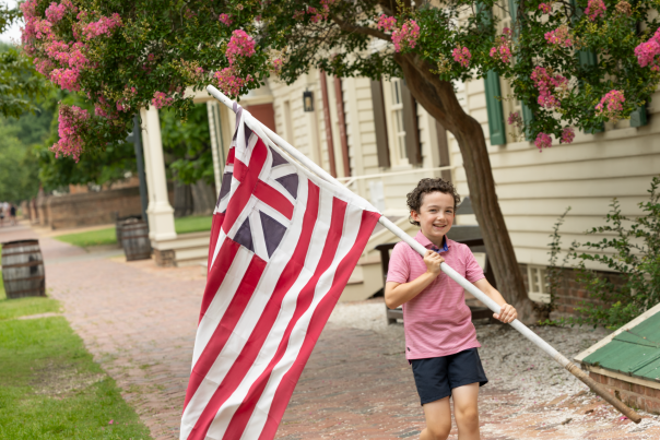 Child holding the Flag at Colonial Williamsburg