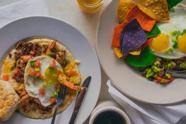 Two breakfast dishes plated at Dixie Grill.