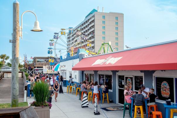 Carolina Beach Boardwalk with Amusement rides in the background