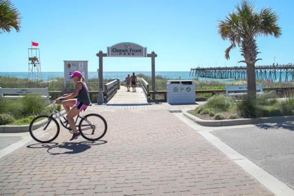 Riding a bike along the oceanfront in Kure Beach