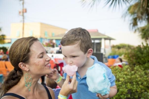Mom feeding kid cotton candy at the Carolina Beach Boardwalk