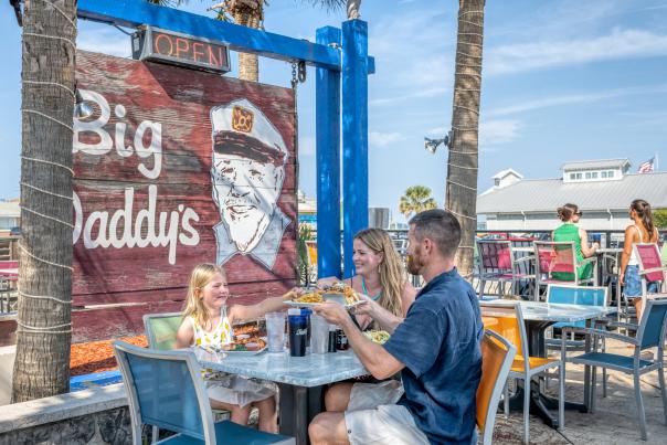 Family dining outdoors on the patio at Big Daddy's Restaurant