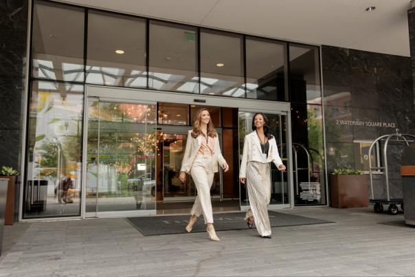 Women walking out of a business meeting in The Woodlands
