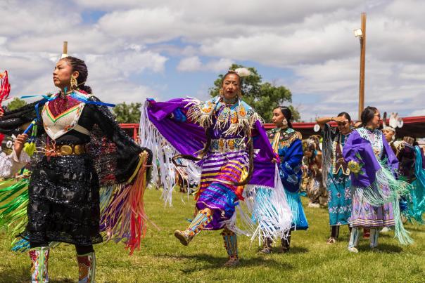 dancers dressed in colorful, traditional regalia