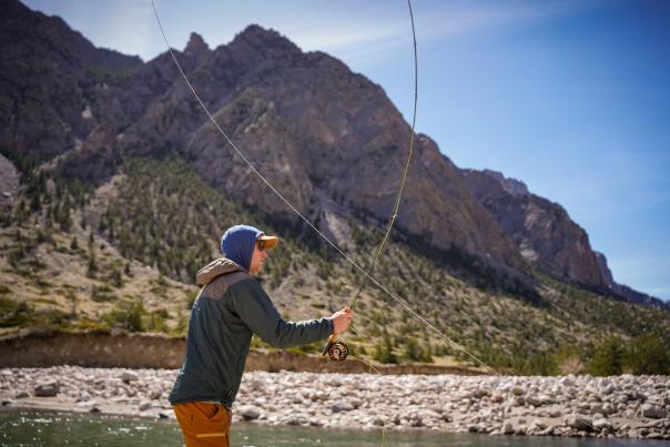 Man fly-fishing in stream near Cody Wyoming