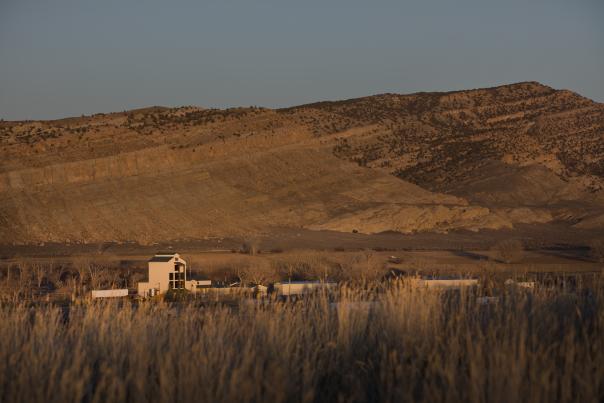 The Wyoming Whiskey distillery in Kirby, Wyoming, is surrounded by expansive fields and the rugged walls of the Bighorn Basin.