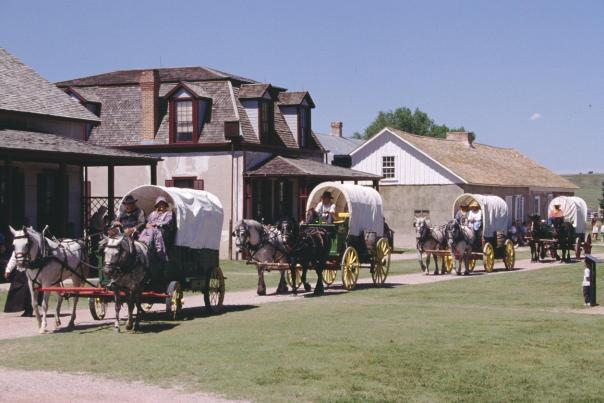 Covered wagons and pioneers at Fort Laramie National Historic Site