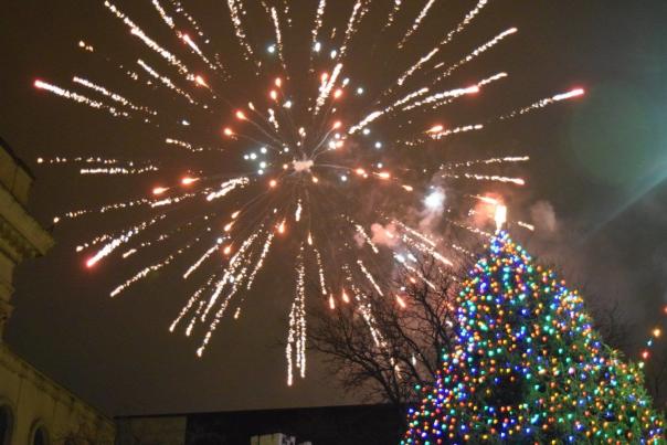 Fireworks in York behind a large Christmas tree