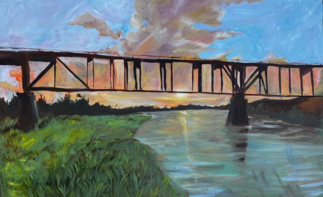 painting showing river, greenery and iron bridge with sunset background