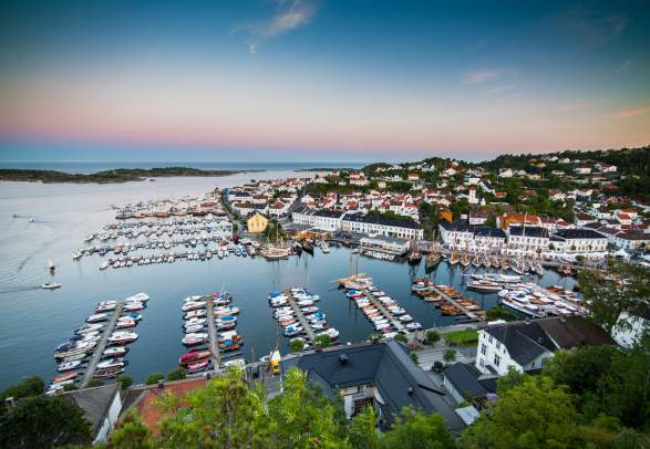 Overview of Risør harbour at dawn