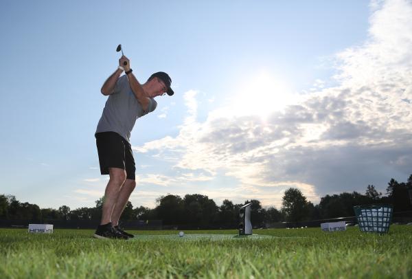 Man Golfing at Community Cup in Columbus