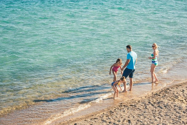 family on beach in canatara