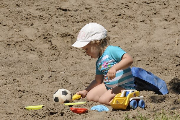 child playing in sand at mitchells bay