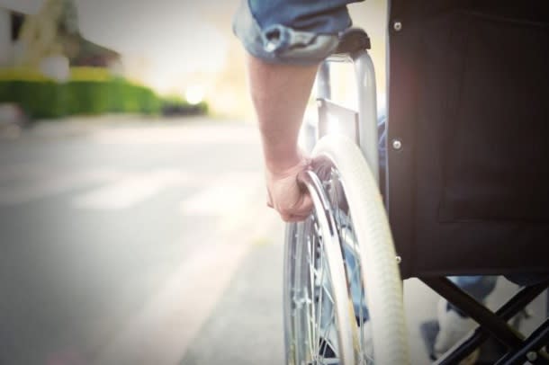 man in on path in wheelchair