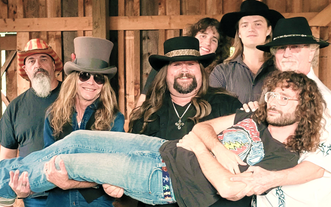 Band photo of Tuesday's Gone, a Lynyrd Skynyrd tribute band.