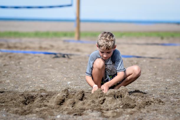 kid in sand at erieau