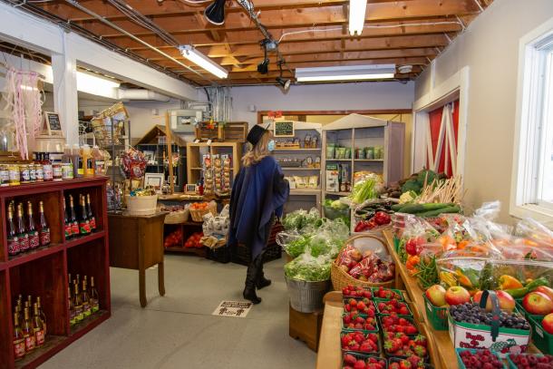 woman at market buying produce