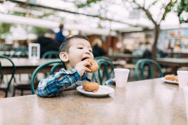 Boy eating donut