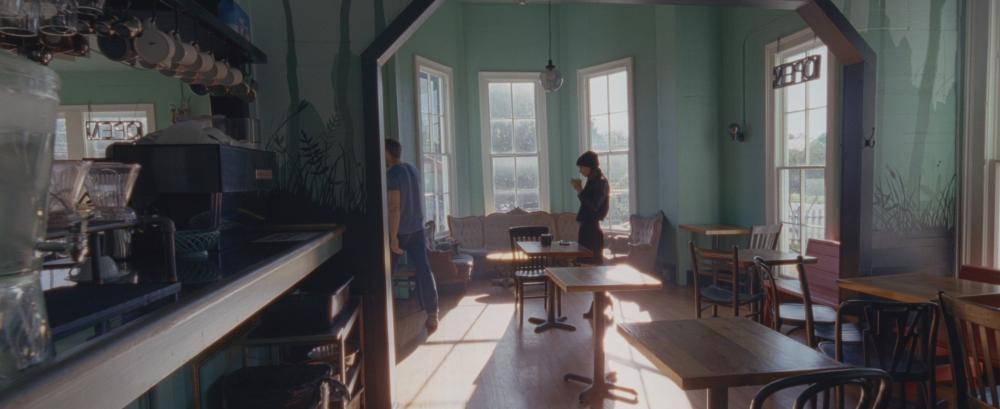 Song to Song screengrab, showing Faye and Cook inside Cenote cafe