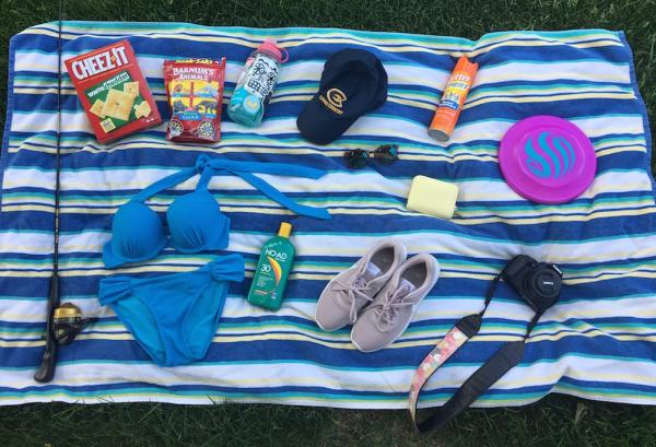 Beach towel with items spread out a day trip to Big Falls