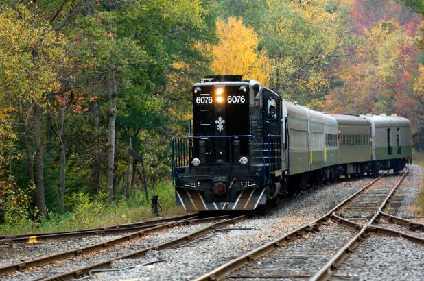 Adirondack Scenic Railroad in Old Forge, train on tracks surrounded by fall foliage