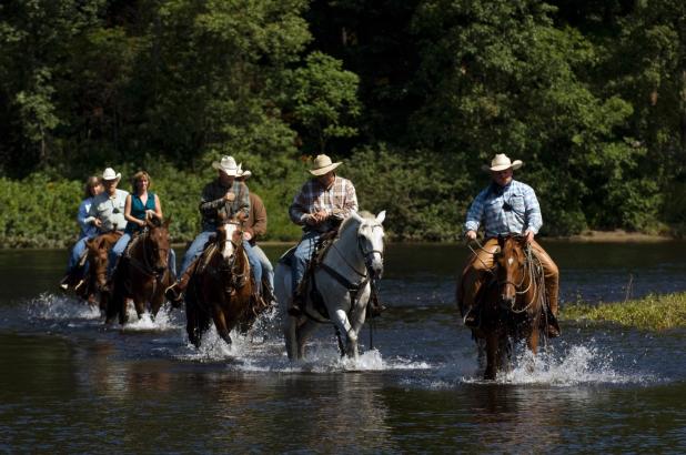 Trail ride through pond at 1000 Acres Ranch (formerly Stony Creek Ranch Resort)