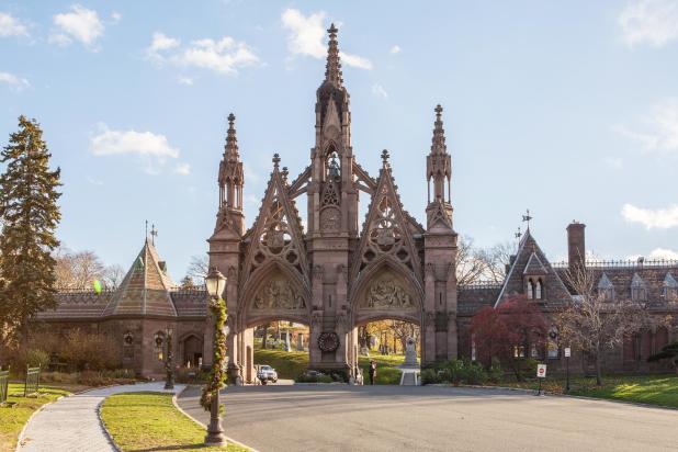 Entrance to the Green-Wood Cemetery on a sunny day surrounded by fall colors