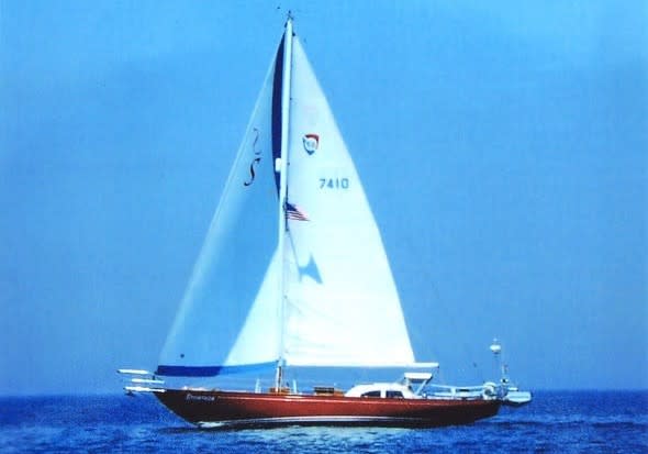 Mackinac Island sailboat charter business Windy Escapes sails Stampede sailboat in blue water