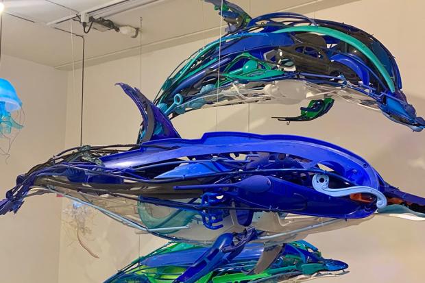 Blue dolphin art made of plastic found in the oceans