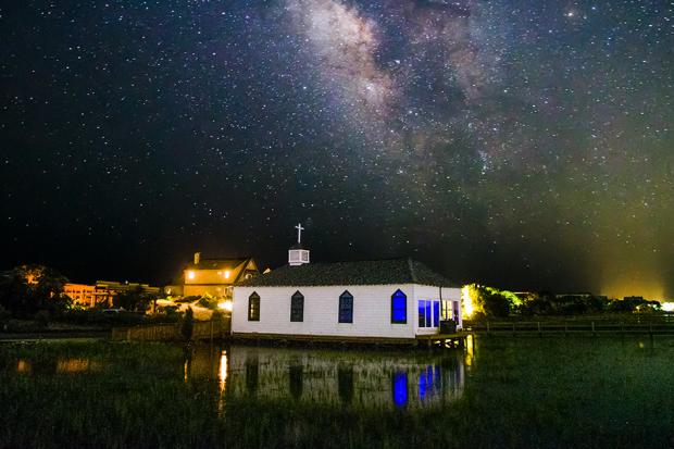 Night shot of church with sky full of stars