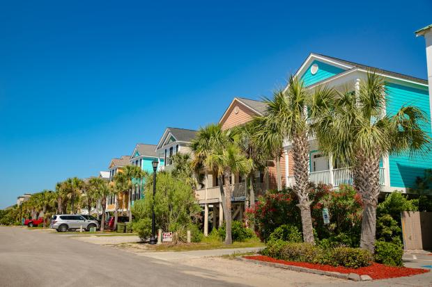 Colorful houses and palm trees in Surfside Beach